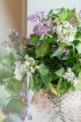 lilac bouquet on the windowsill at home