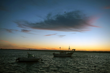 Fototapeta na wymiar Pier with boats in the sea during sunset,