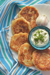 Potato pancakes with sour cream