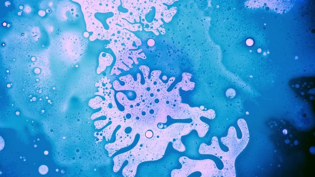 4K psychedelic liquid light show, weird patterns of ink in water, oil, paint, liquids, pulsing bubbles. Colorful background for avant-garde visual performances, logos, music videos, titles, credits