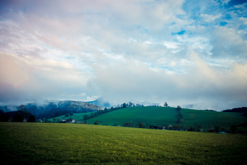 Obraz premium Beautiful foggy landscape in the mountains after rain, Alps, Austria.