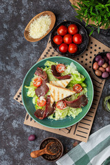 Fresh roastbeef salad with green iceberg and parmesan cheese