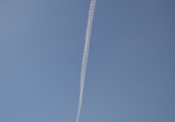 
white streak located in the clear sky