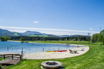 Beautiful lake in the Alps mountains, Austria. Summer relaxation area near the lake.