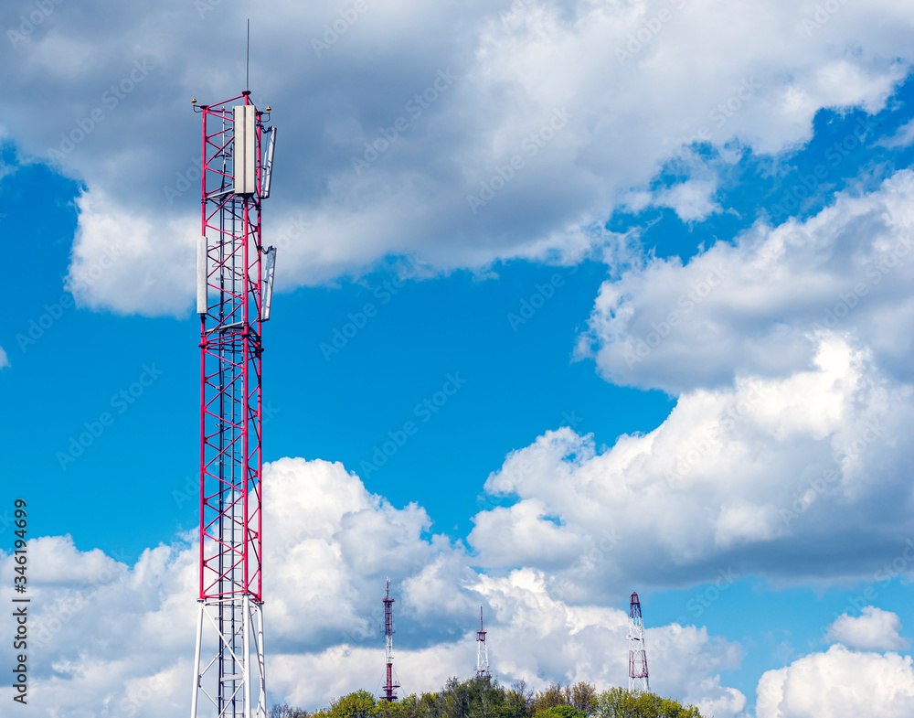 Wall mural many phone metal towers against blue bright sky. equipment for cellular communications 4g and 5g. tr