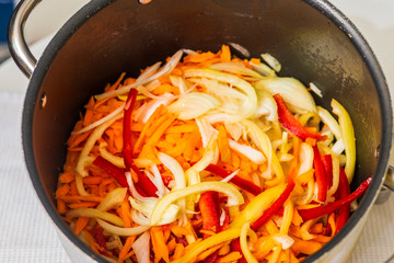 various freshly cut vegetables in a pot