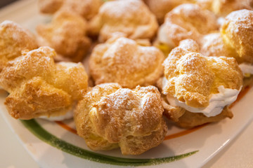 Choux cream or cream puffs in a tray fresh