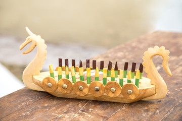 Children's wooden toy with metal rivets, model of the Viking boat drakkar.