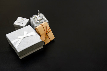 Close-up of gift boxes laying on the black table