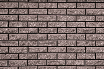 Brown background with black geometric patterns. Brown wall of rectangular stones, bricks, tile