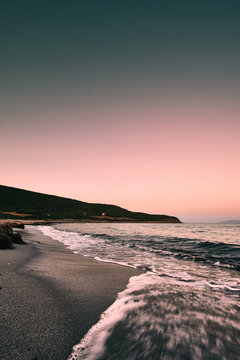 dramatic sunset Plage de tamarone beach near cap corse, mediterranean france island