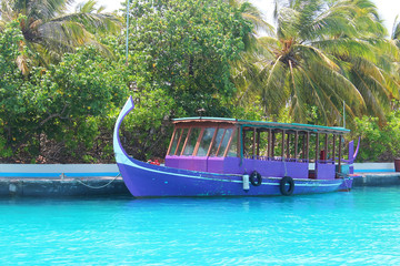 Traditional fishing boat moored in the local port of Nalaguraidhoo island, Indian ocean, Maldives.
The concept of beach holidays