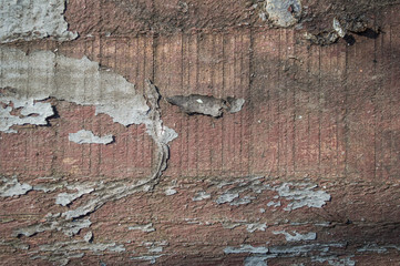 Old wooden fence painted by red paint. Texture