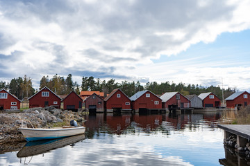 Fototapeta na wymiar Fishing village on the Baltic coast. View from the bay. Scandinavian landscape. Swedish coast.