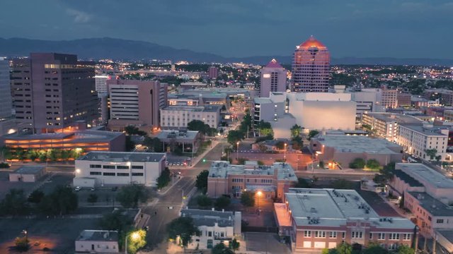 Albuquerque, New Mexico, USA. Aerial flying over the downtown city CBD at night