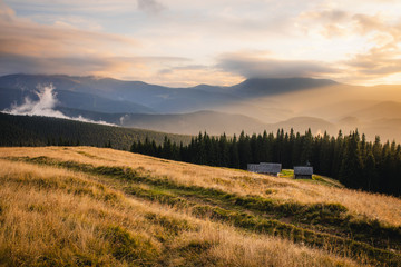 Naklejka premium Bright sunset in summer mountains