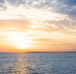 dramatic sunset over the quiet sea bay, outdoor vacation scene