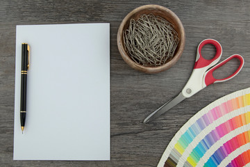 Top view of empty white page and designers color range