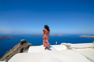 Portrait of an Israeli woman. Woman posing on the background of the Mediterranean Sea on the island of Santorini.