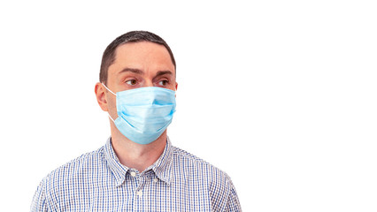 Handsome business man wearing medical face mask isolated on white background. Personal protection. Coronavirus COVID-19. Copy space