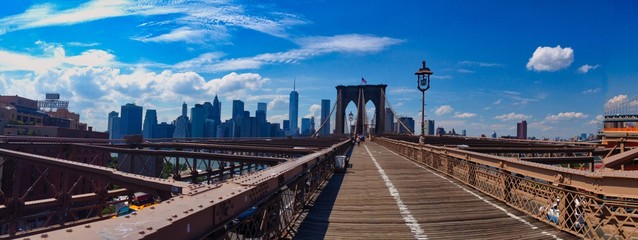 Fototapeta na wymiar Panoramic photo of Brooklyn Bridge during sunny day.