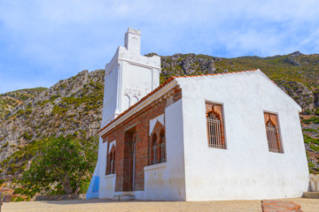 White Spanish Mosque ‘Mosquee bouzaafar’ on a background of Rif mountains in the Chefchaouen...