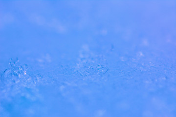 Obraz premium Frozen water blue background.