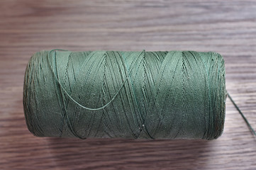 large spool of strong green thread