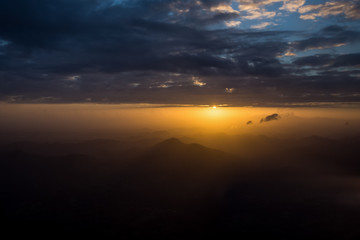 Sunset sunrise orange landscape in dramatic cloudy heaven sky aerial view