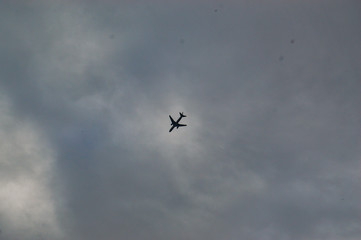 Naklejka na ściany i meble aeroplane in sky