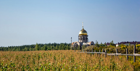The word URGENT. Wooden cubes with letters isolated on red background with copy space. Wooden doll...