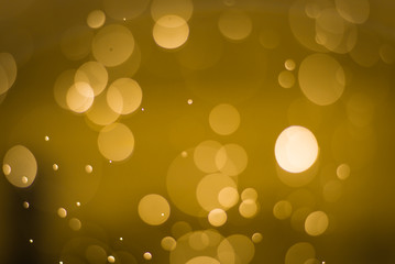 abstract gold background with soft blur bokeh light effect, background bokeh