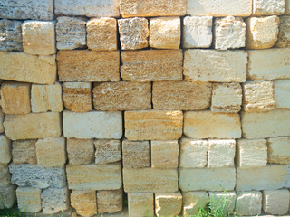 the stacked bricks of limestone close up.