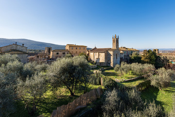 Fototapeta premium Medieval village of Monteriggioni. Church of Santa Maria Assunta (XIII century) and surrounding wall. Siena province, Tuscany, Italy, Europe
