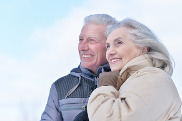 Portrait of happy senior couple at winter outdoors