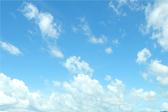 blue sky background with tiny clouds