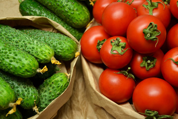 Fresh vegetables from farmers market. Cucumbers, tomatoes. Pickle cucumbers. Organic vegetables. Salad ingredients.