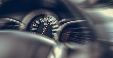 Car speedometer. High speed on a car speedometer and motion blur.