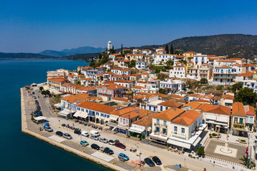 Fototapeta na wymiar Top aerial view of the Poros island Sea harbor, Aegean sea, Greece. Panoramic view of city Poros