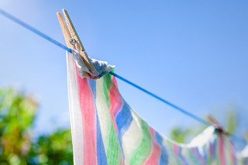 Freshly washed towels or sheets hanging to dry on a clothes line.