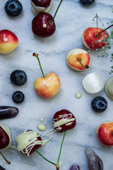 still life of berries and gemstones