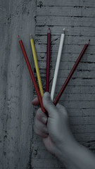 crayons in the palm of a woman