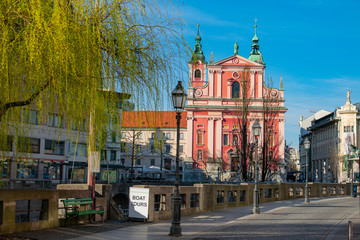 Beautiful church overlooks empty Prešeren Square and empty cobblestone streets.