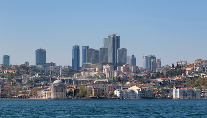 Fototapeta premium Istanbul, Turkey - a natural separation between Europe and Asia, the Bosporus is a main landmark in Istanbul. Here in particular a glimps of its waters and buildings