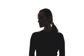 black and white silhouette of woman with head turned sideways, portrait