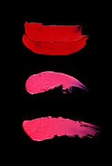 Texture and Stroke of Red Lipstick on Black Background