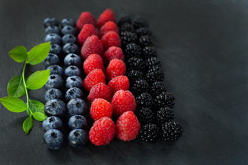 blueberries, raspberries and blackberries on slate, berries, summer crop