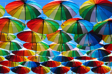 Beautiful bright multi-colored umbrellas, a symbol of summer tourism