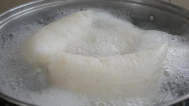Nasi Impit or pressed rice in the plastic pack is boiled using hot water in a pan. Nasi Impit is usually cooked by Malay Muslims during Eid Celebration in Malaysia.