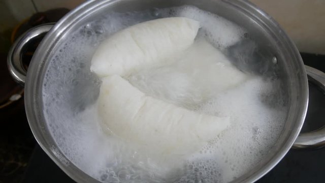Nasi Impit or pressed rice in the plastic pack is boiled using hot water in a pan. Nasi Impit is usually cooked by Malay Muslims during Eid Celebration in Malaysia.